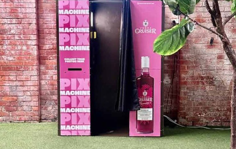 Photo booth in a full sponsor wrap for a drinks brand