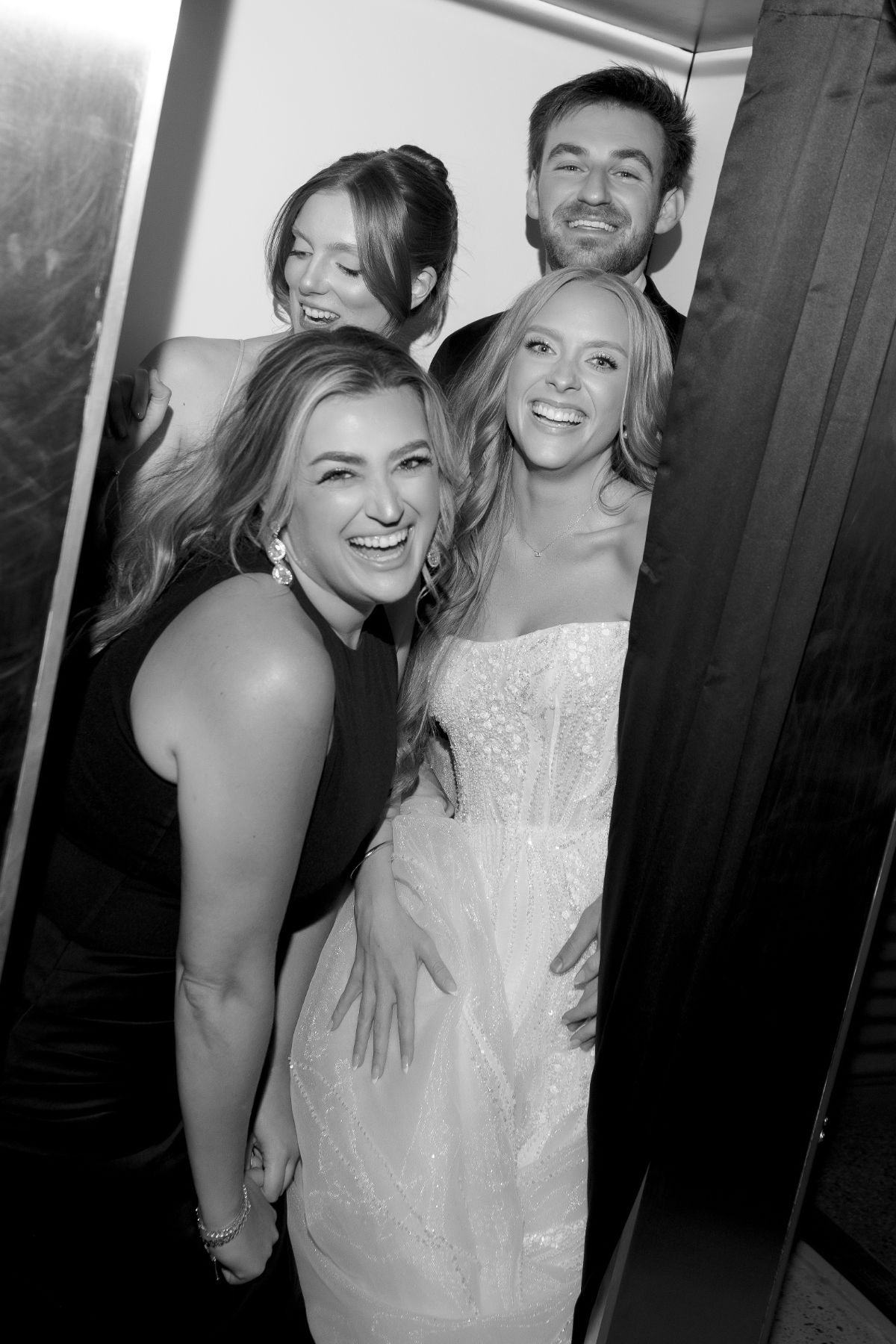 Guests laughing inside the booth