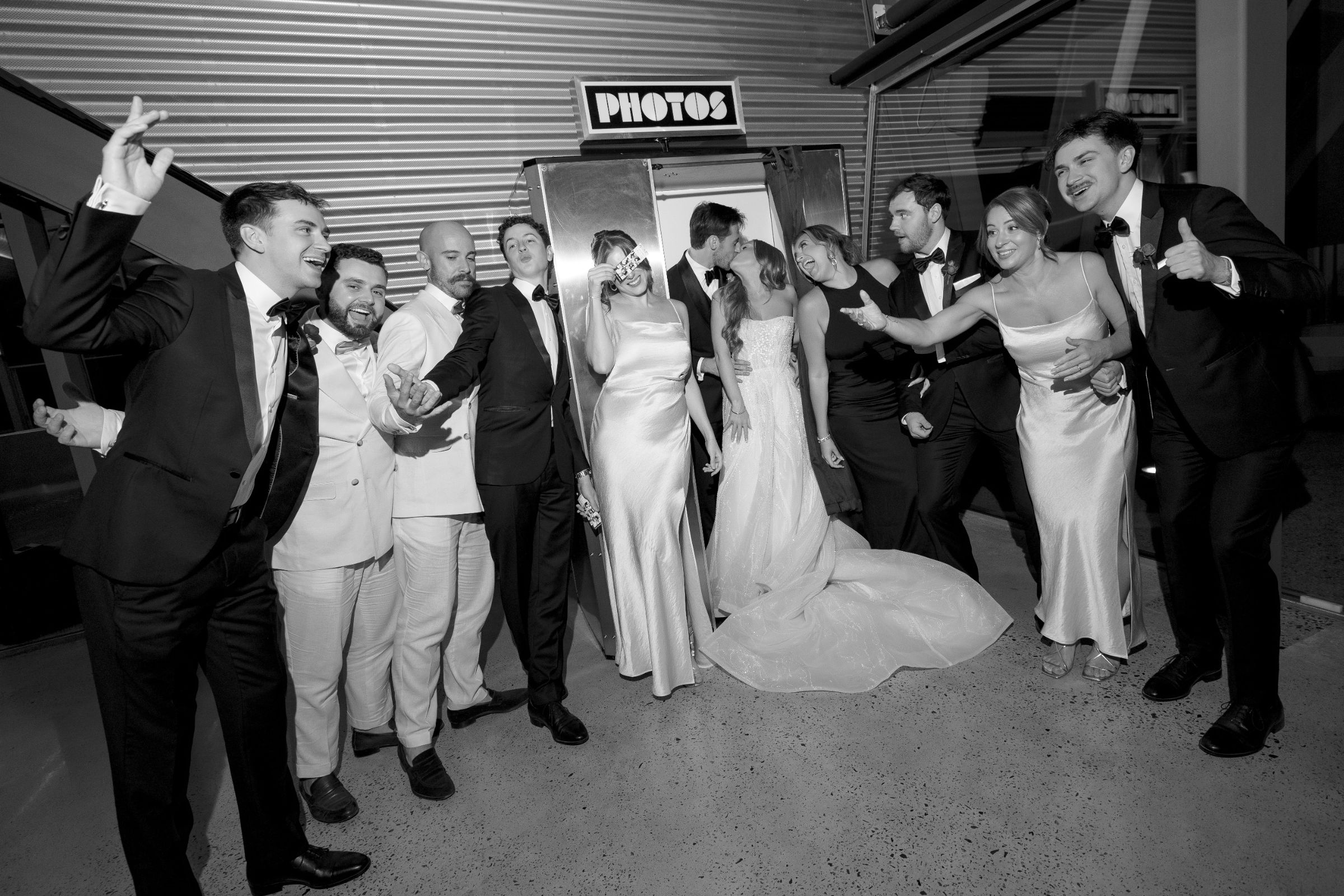 Wedding party celebrating around a Retro Booth